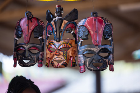 Handmade masks made of wood and painted with different colors for saleの写真素材