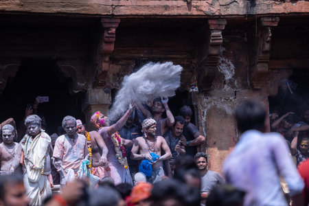 Varanasi, Uttar Pradesh, India - March 04 2023: Masan Holi, Group of india people with painted face celebrating the festival of holi at manikarnika ghat with rituals.のeditorial素材