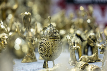 Gold and silver figurines for sale at a souvenir shop.
