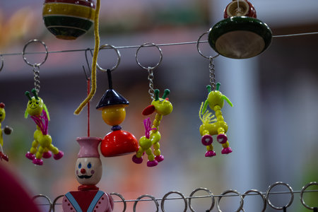 Colorful clay doll hanging on the wire in the market.の写真素材