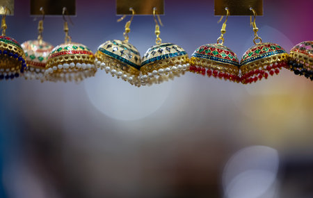 Close up of colorful earrings for sale at a souvenir shopの写真素材