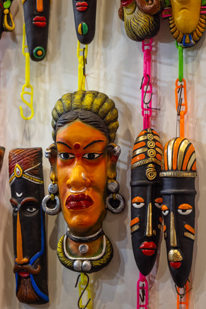 Colorful African masks on display at a souvenir shop.の写真素材