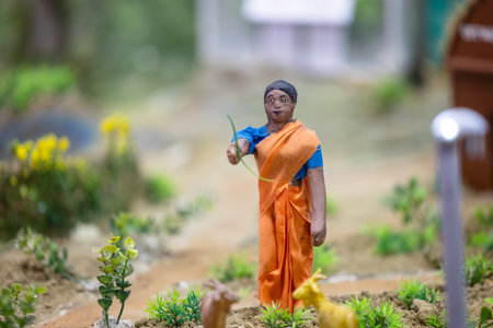 Miniature buddhist monk in the garden.