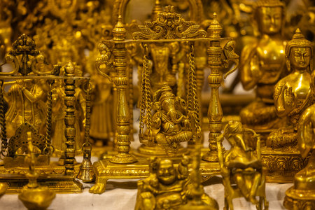 Golden statue of Buddha in the Buddhist temple, closeup of photoの写真素材