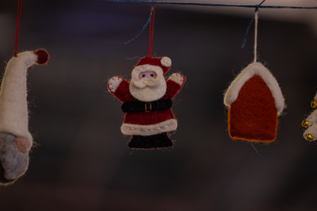 Christmas decoration hanging on a rope with Santa Claus and snowflakesの写真素材