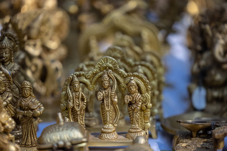 Close-up of golden statuettes of gods in a shopの写真素材