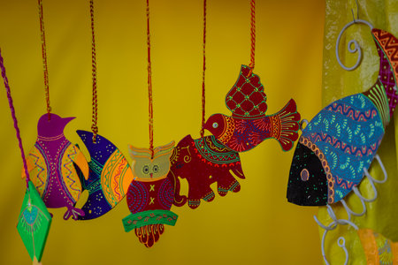Colorful fish for decoration on a yellow background. The concept of the celebration.の写真素材