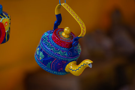 Colorful ceramic teapot for sale at a market in Indiaの写真素材