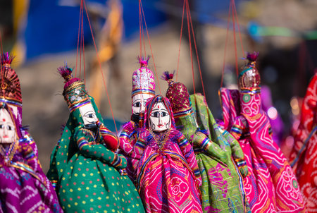 Colorful puppets for sale at the local market in India.の写真素材