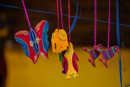 Colorful handmade handcrafts in the shape of a bird.