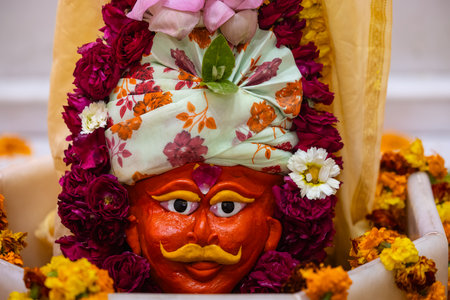 Shivling or shiv lingam decorated with colours and flowers to worship lord shiv. Selective focus.