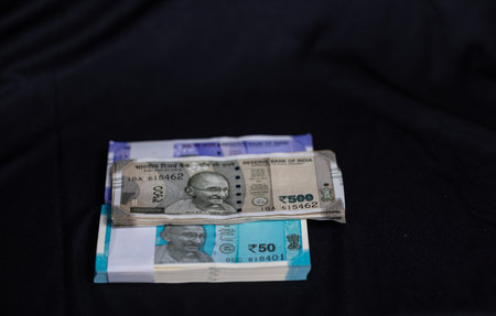 Money in the pocket of a black jacket. Close-up.