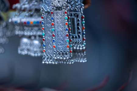 Close-up of silver necklaces for sale in a souvenir shopの写真素材
