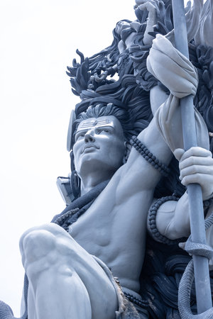 Lord Shiva, Handmade statue of lord shiv with plain background near river sea at Aazhimala in kerala. Selective focus.の写真素材