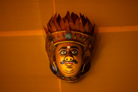 Handmade colorful face mask hanging on plain background. Selective focus on object.の写真素材