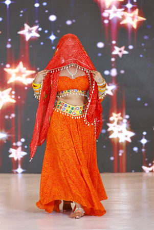 Portrait of an unidentified female artist performing classical dance in ethnic indian clothes.の写真素材