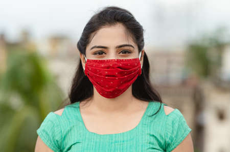 Asian / Indian woman wearing face mask against Pollution, Coronavirus or COVID-19.の写真素材