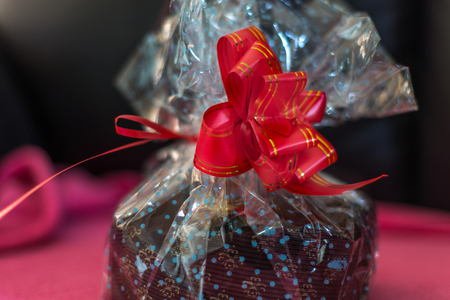 Christmas cake wrapped with red ribbonの写真素材