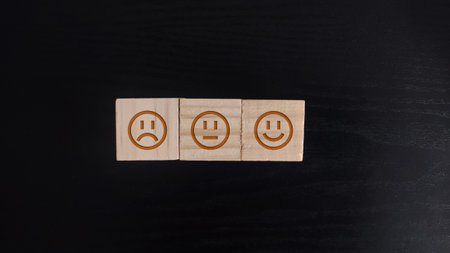 wooden block with the smile icon. customer review, feedback, rateの写真素材