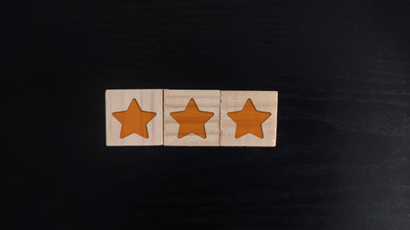 wooden block with the smile icon. customer review, feedback, rateの写真素材