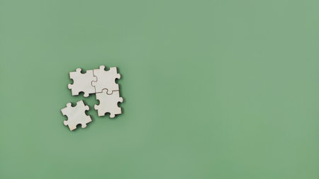 Top view incomplete empty wood puzzle on green backgroundの写真素材