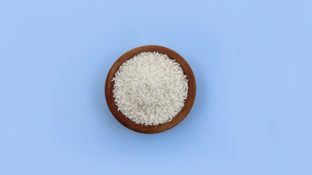 Top view rice in bowl isolated on blue backgroundの写真素材