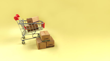 bulk parcel boxes and shopping cart.  logistics, delivery, online shopping conceptの写真素材
