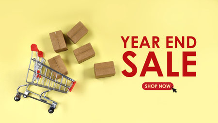 bulk parcel boxes and shopping cart with year end sale text. sales, offer, online shopping conceptの写真素材