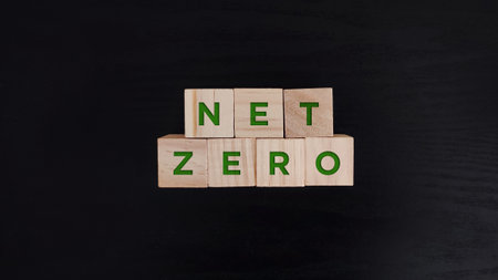 wooden block with net zero green text. sustainability, environmental conceptの写真素材
