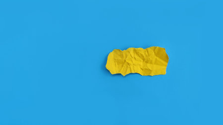 Minimal blank torn paper on blue background, perfect for copy space, message placement and creative concept for notes or reminders.