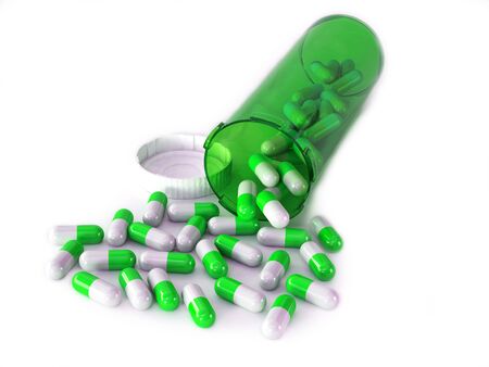 medical background of a bottle and pills Isolated on white backgrounの写真素材