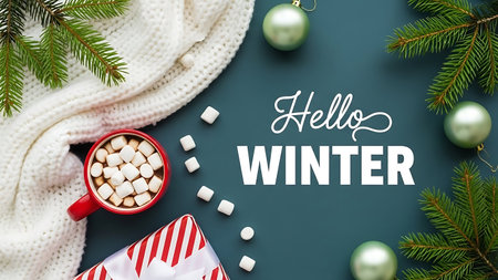 Hello Winter text with hot chocolatehmallows and Christmas decorations on dark green backgroundの素材