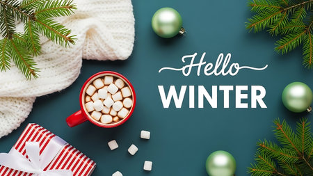 Hello winter lettering with hot chocolatehmallows and christmas decorations on green backgroundの素材