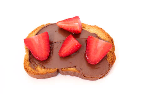 toast with chocolate paste and strawberry slices isolatedの写真素材