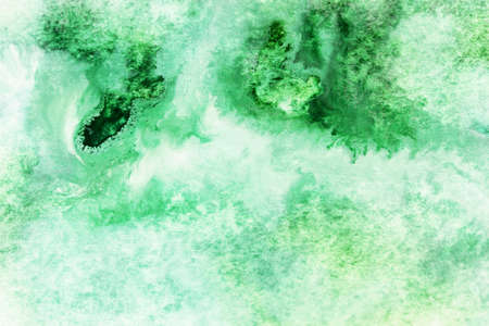 gentle background with green watercolor smudgesの写真素材