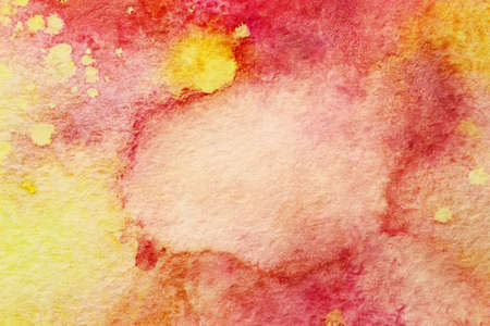 deep red watercolor smudges and yellow splashesの写真素材