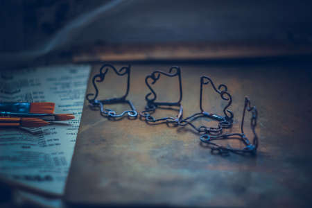Soldering metal wires with butane gas flame burner - close up shotの写真素材