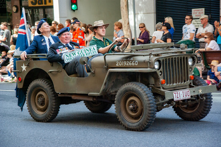 Proud New Guinea Volunteer Rifle soldiers parade on Anzac Day in Brisbane to appreciative crowds.のeditorial素材