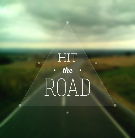 Hit the Road poster. Text in a triangle on a defocused road stretching to the horizon. EPS10 vector inage.のイラスト素材