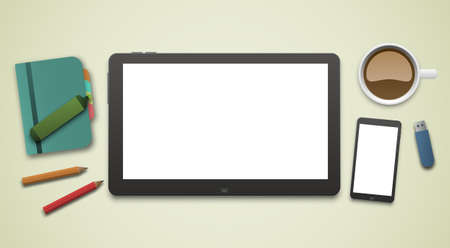 Working desk with an empty blank tablet PC screen and a white screen smartphone