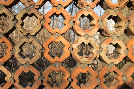 Brick fence of vintage shape in city park. Sunny dayの写真素材