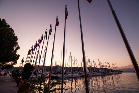 Yachts in bay with evening light. Mediterranean sea and calm weatherの写真素材