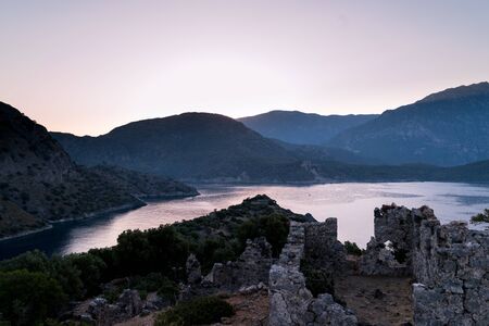 Sunrise over sea and mountains. Rocks and water senery. Turkey landscapeの写真素材