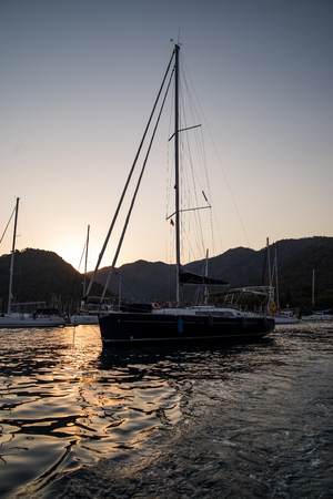 Yachts in bay with evening light. Mediterranean sea and calm weatherのeditorial素材