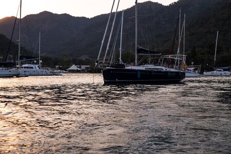 Yachts in bay with evening light. Mediterranean sea and calm weatherのeditorial素材