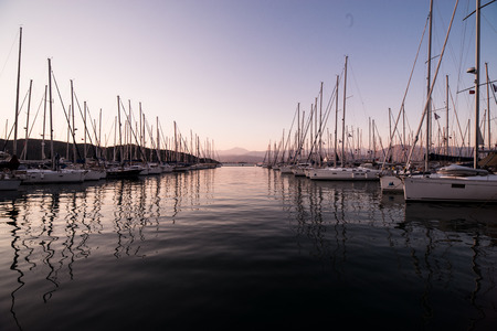 Yachts in bay with evening light. Mediterranean sea and calm weather