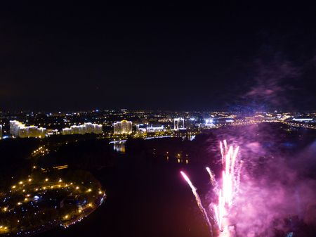 Firework shoot from drone. River and night city view. Musical festival endの写真素材