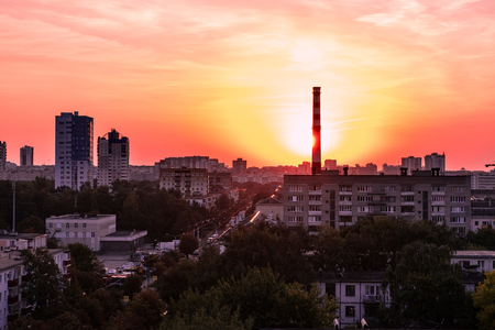 Sunrise over shabby district of Minsk city. Bright sky and red colors of natureの写真素材