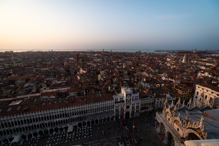 Venice city view from height. Houses roofs and sky at the sunset. Warm colorsの写真素材