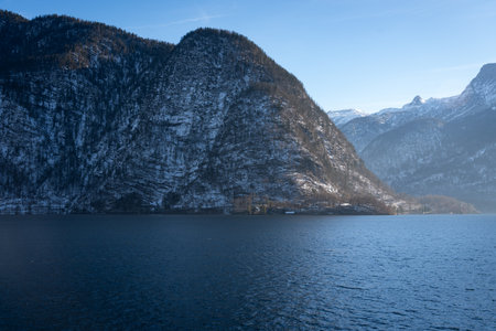 Bright sunny winter day, Alps, Hallstatt lake and village view.の写真素材